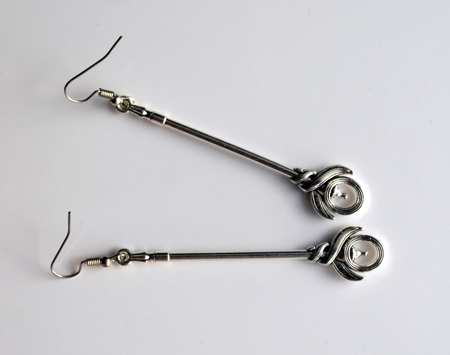 Silver Toned Two Handed Staff Style Weapon Earrings (Ear Hook, Stud and Clip On)