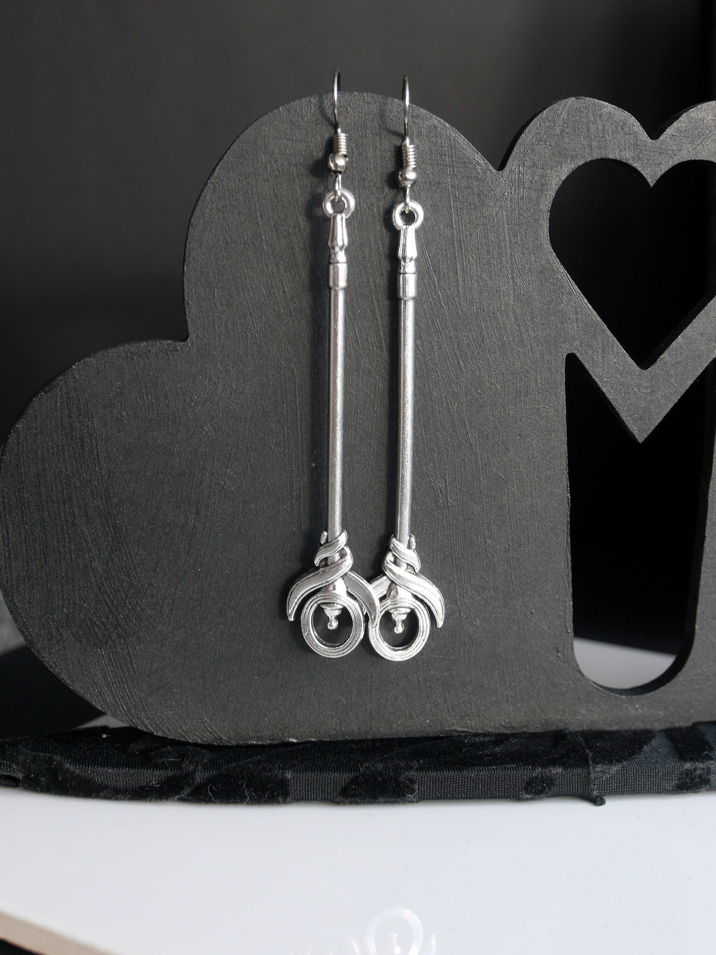 Silver Toned Two Handed Staff Style Weapon Earrings (Ear Hook, Stud and Clip On)