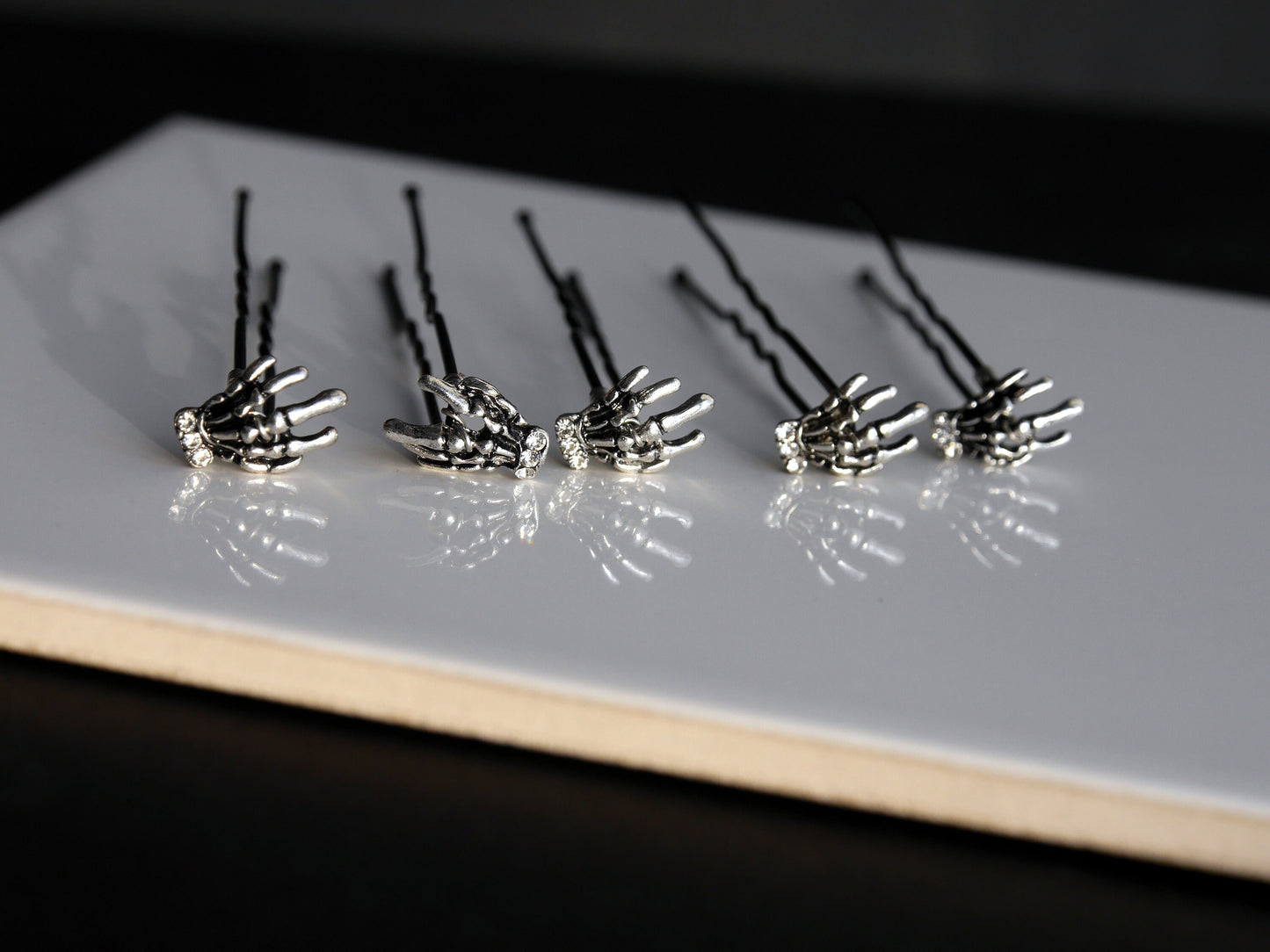 A set of 5 hand made wedding / ballet dance hair pins with silver toned skeleton hands (12 mm x 8 mm). Hands have diamante detail.